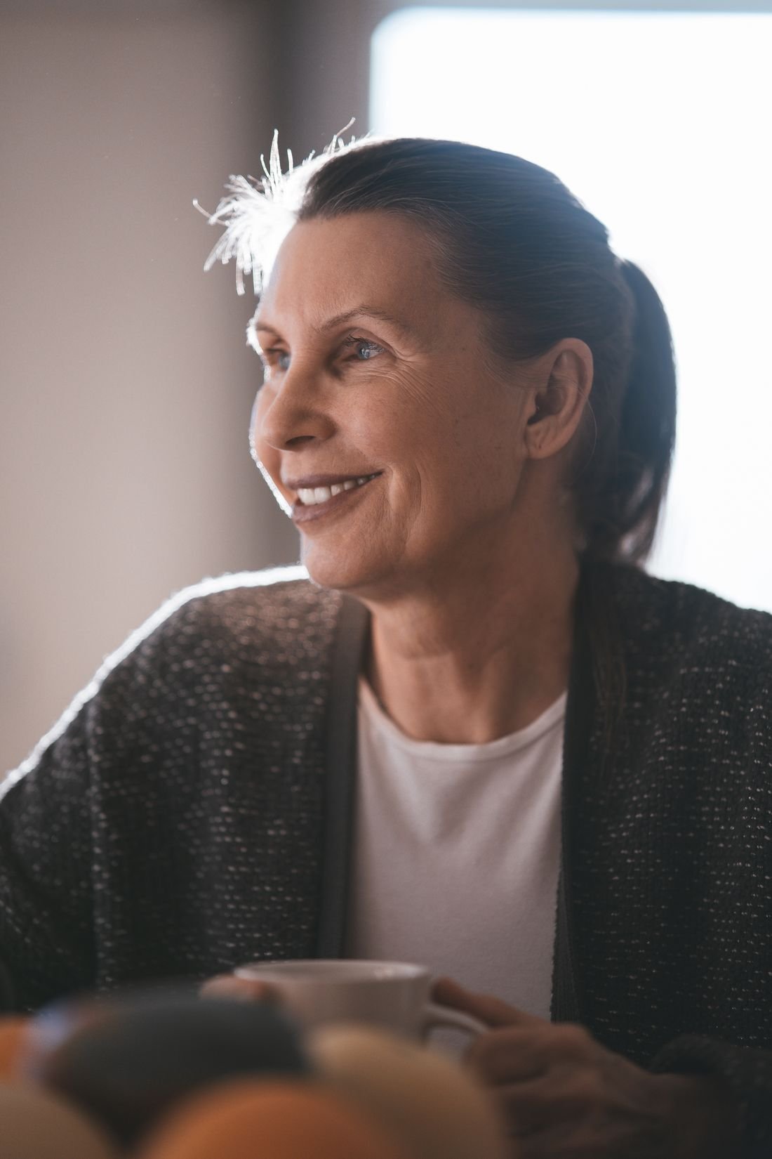A relaxed, smiling person who manages chronic pain